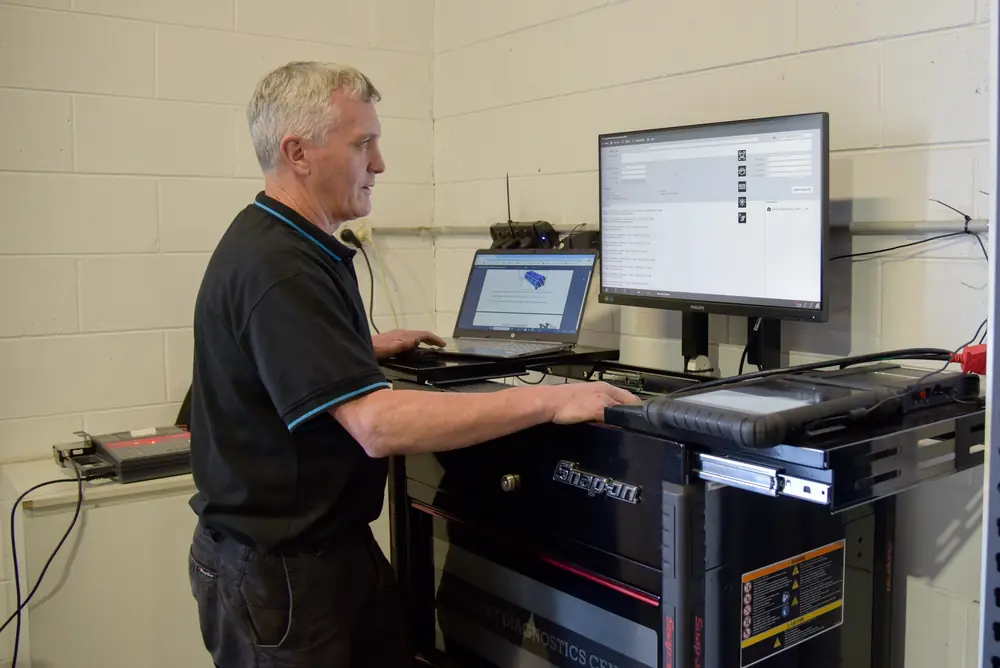 Mechanic at a diagnostic workstation
