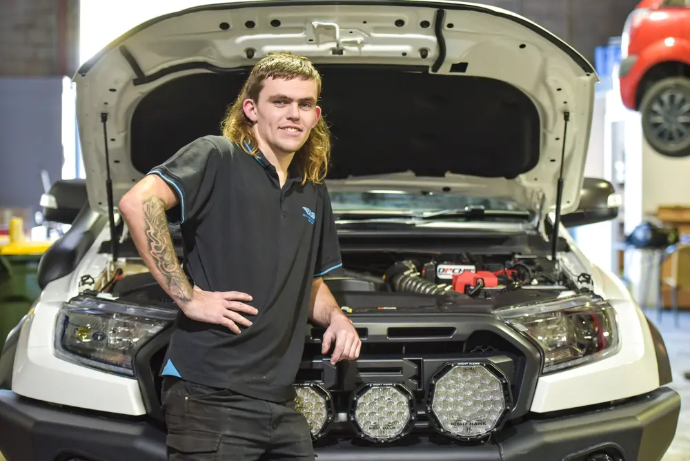 Mechanic beside a vehicle in the workshop