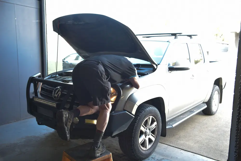 Mechanic servicing a four-wheel drive